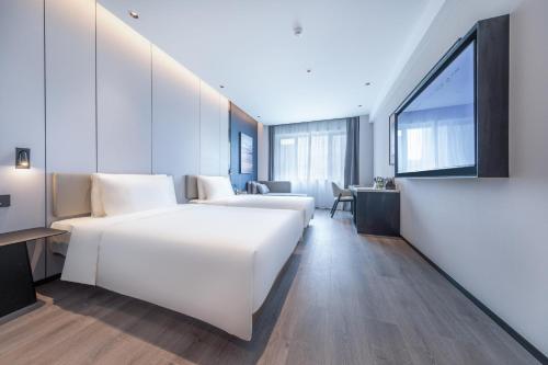 Imagen de la habitación del Hotel Atour Qingdao Laoshan Shilaoren Beach. Foto 16