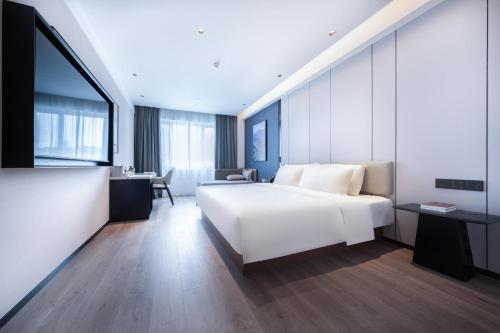 Imagen de la habitación del Hotel Atour Qingdao Laoshan Shilaoren Beach. Foto 17