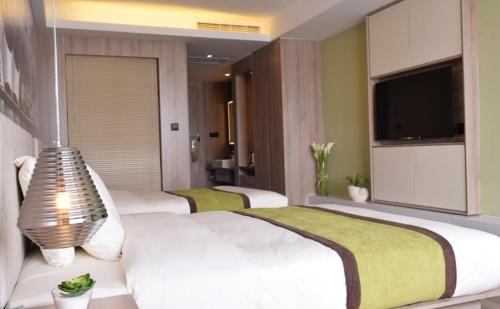 Imagen de la habitación del Hotel Atour Qingdao Olympic Sailing Center May Fourth Square. Foto 5