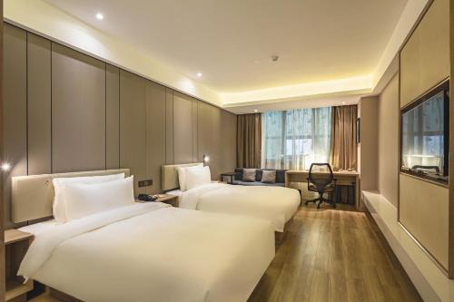 Imagen de la habitación del Hotel Atour Qingdao Olympic Sailing Center May Fourth Square. Foto 6