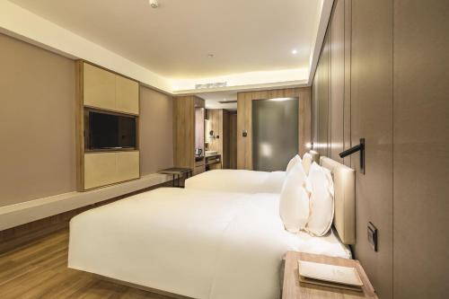 Imagen de la habitación del Hotel Atour Qingdao Olympic Sailing Center May Fourth Square. Foto 7