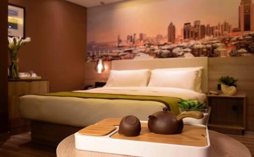 Imagen de la habitación del Hotel Atour Qingdao Olympic Sailing Center May Fourth Square. Foto 8