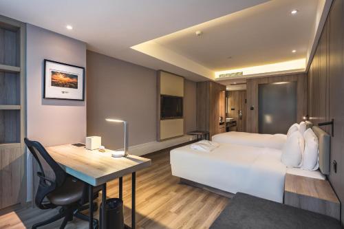 Imagen de la habitación del Hotel Atour Qingdao Olympic Sailing Center May Fourth Square. Foto 11