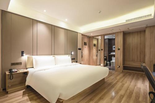 Imagen de la habitación del Hotel Atour Qingdao Olympic Sailing Center May Fourth Square. Foto 12