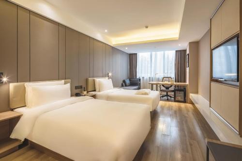 Imagen de la habitación del Hotel Atour Qingdao Olympic Sailing Center May Fourth Square. Foto 14