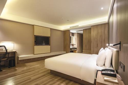 Imagen de la habitación del Hotel Atour Qingdao Olympic Sailing Center May Fourth Square. Foto 15