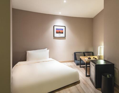 Imagen de la habitación del Hotel Atour Qingdao Olympic Sailing Center May Fourth Square. Foto 17
