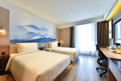 Imagen de la habitación del Hotel Atour Qinhuangdao Nandaihe Xianluo Island. Foto 3