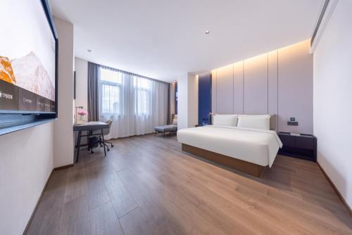 Imagen de la habitación del Hotel Atour Qujing Qilin. Foto 11