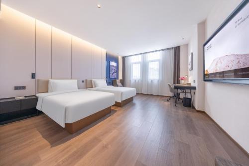 Imagen de la habitación del Hotel Atour Qujing Qilin. Foto 12