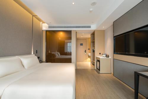 Imagen de la habitación del Hotel Atour Quzhou Nankong. Foto 11