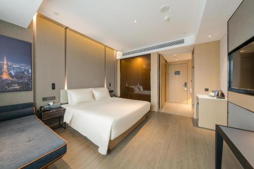 Imagen de la habitación del Hotel Atour Quzhou Nankong. Foto 12