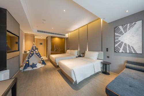 Imagen de la habitación del Hotel Atour Quzhou Nankong. Foto 16