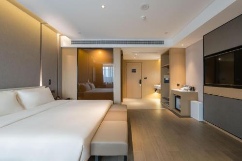 Imagen de la habitación del Hotel Atour Quzhou Nankong. Foto 20