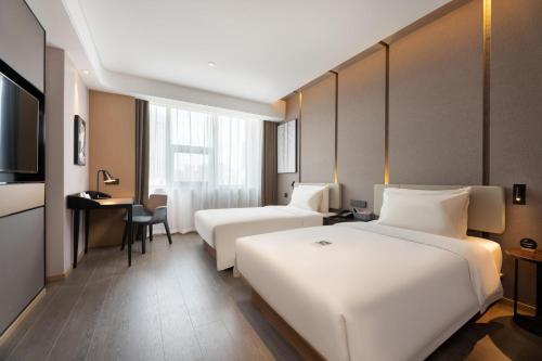 Imagen de la habitación del Hotel Atour S Xinghai Square. Foto 8
