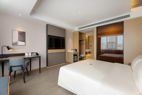 Imagen de la habitación del Hotel Atour S Xinghai Square. Foto 9