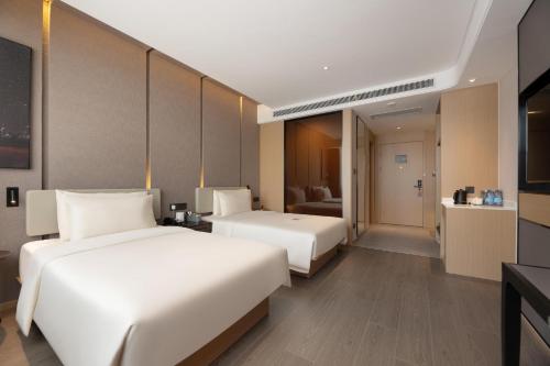 Imagen de la habitación del Hotel Atour S Xinghai Square. Foto 10