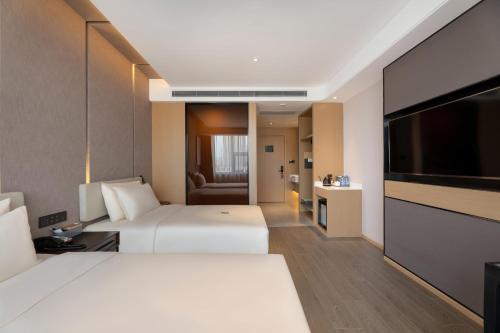 Imagen de la habitación del Hotel Atour S Xinghai Square. Foto 12