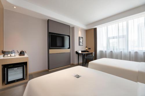 Imagen de la habitación del Hotel Atour S Xinghai Square. Foto 14