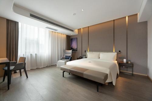Imagen de la habitación del Hotel Atour S Xinghai Square. Foto 16