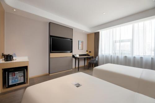 Imagen de la habitación del Hotel Atour S Xinghai Square. Foto 17