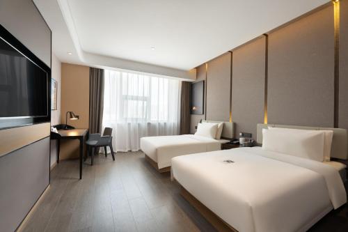 Imagen de la habitación del Hotel Atour S Xinghai Square. Foto 18