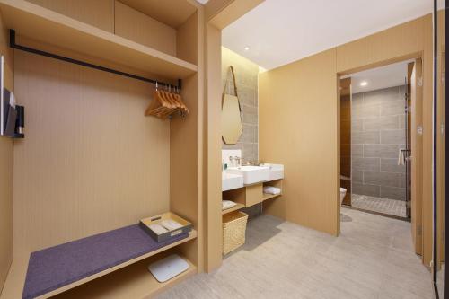 Imagen de la habitación del Hotel Atour S Xinghai Square. Foto 20