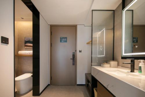 Imagen de la habitación del Hotel Atour Shanghai Baoshan Shangda Road. Foto 19