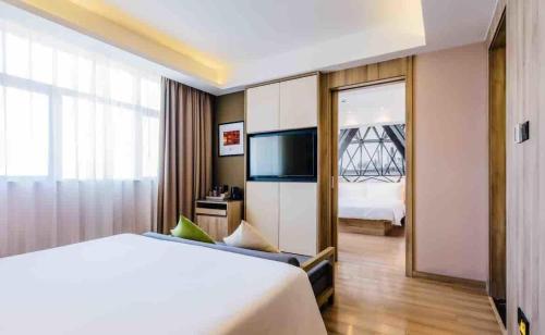 Imagen de la habitación del Hotel Atour (Shanghai International Tourism and Resorts Zone XiuYan Road). Foto 14