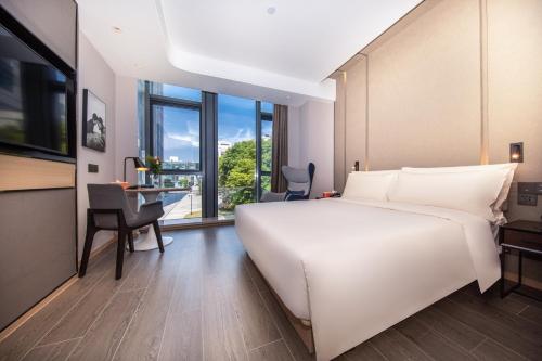 Imagen de la habitación del Hotel Atour Shanghai Wujiaochang Daxue Road. Foto 13