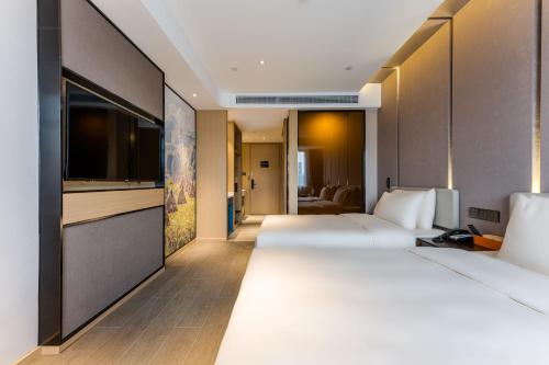 Imagen de la habitación del Hotel Atour Shengzhou. Foto 16