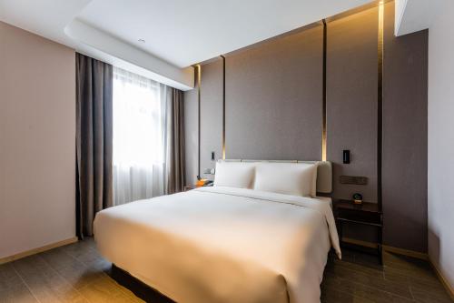 Imagen de la habitación del Hotel Atour Shengzhou. Foto 20