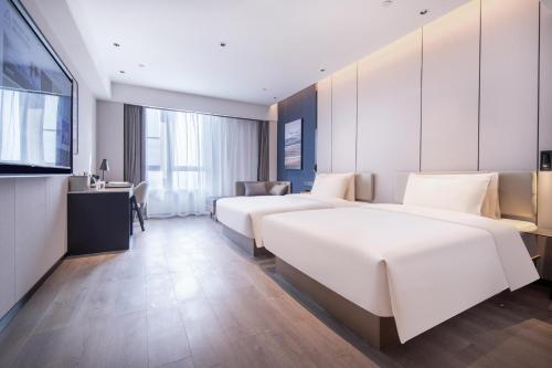 Imagen de la habitación del Hotel Atour Suqian Industrial Park Wuyue Plaza. Foto 15