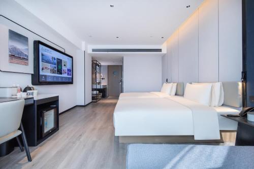 Imagen de la habitación del Hotel Atour Suqian Industrial Park Wuyue Plaza. Foto 17