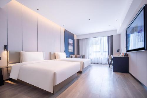 Imagen de la habitación del Hotel Atour Suqian Industrial Park Wuyue Plaza. Foto 20