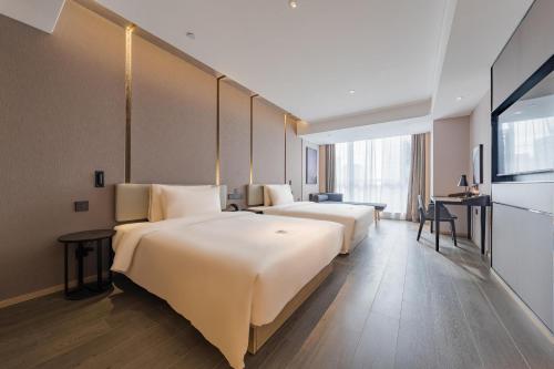Imagen de la habitación del Hotel Atour Suzhou Wujiang Suzhou Bay. Foto 15