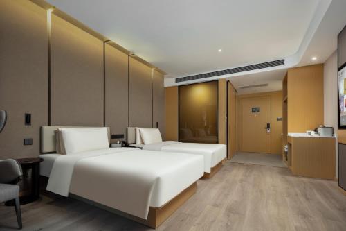 Imagen de la habitación del Hotel Atour Suzhou Wuzhong Taihu New Town. Foto 13