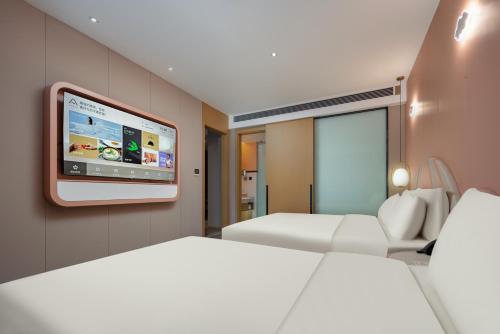Imagen de la habitación del Hotel Atour Suzhou Wuzhong Taihu New Town. Foto 15