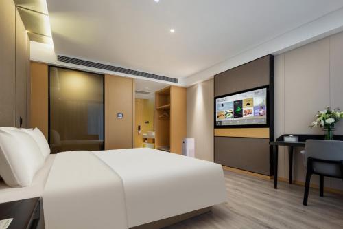 Imagen de la habitación del Hotel Atour Suzhou Wuzhong Taihu New Town. Foto 17