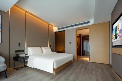 Imagen de la habitación del Hotel Atour Suzhou Wuzhong Taihu New Town. Foto 18