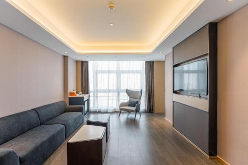 Imagen de la habitación del Hotel Atour Tianjin Binhai High Speed Railway Station. Foto 9