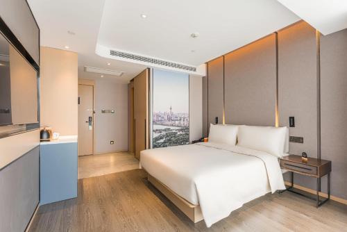 Imagen de la habitación del Hotel Atour Tianjin Binhai High Speed Railway Station. Foto 11