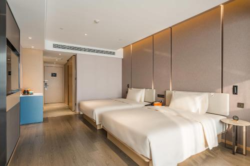 Imagen de la habitación del Hotel Atour Tianjin Binhai High Speed Railway Station. Foto 13