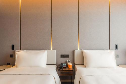 Imagen de la habitación del Hotel Atour Tianjin Binhai High Speed Railway Station. Foto 15