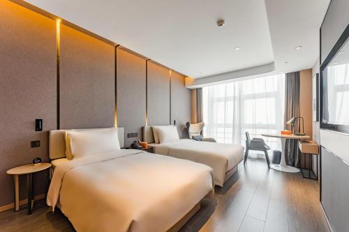 Imagen de la habitación del Hotel Atour Tianjin Binhai High Speed Railway Station. Foto 17