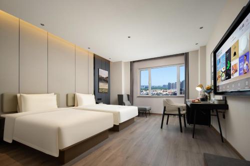 Imagen de la habitación del Hotel Atour Tianjin Zhongbei Haitai Industrial Park. Foto 17