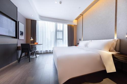 Imagen de la habitación del Hotel Atour Wuhan Tiandi Hankou Jiangtan. Foto 15