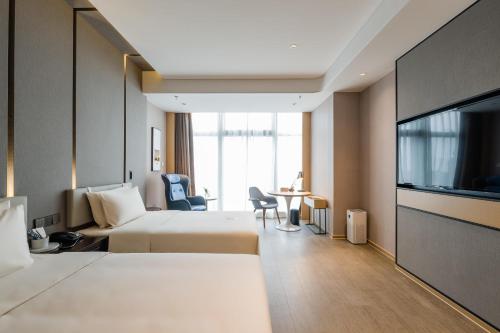 Imagen de la habitación del Hotel Atour Wuxi Coast City. Foto 10