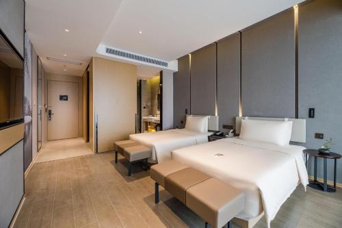 Imagen de la habitación del Hotel Atour Wuxi Coast City. Foto 11