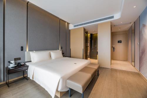 Imagen de la habitación del Hotel Atour Wuxi Coast City. Foto 12